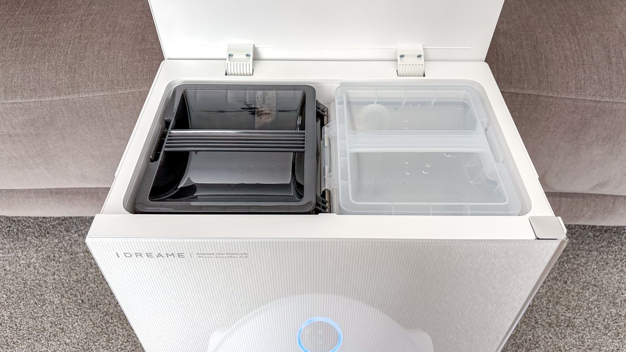 Dreame X60 Max Ultra Complete in white photographed on gray carpet.