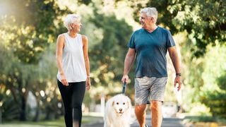 seniors walking dog outside