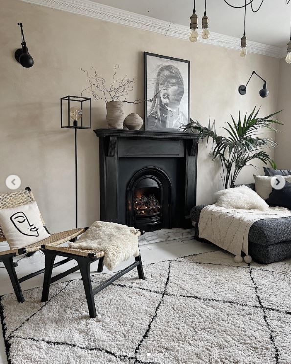 The living room with a large rug over the wooden floor