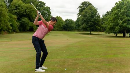 An iron shot being played into the green