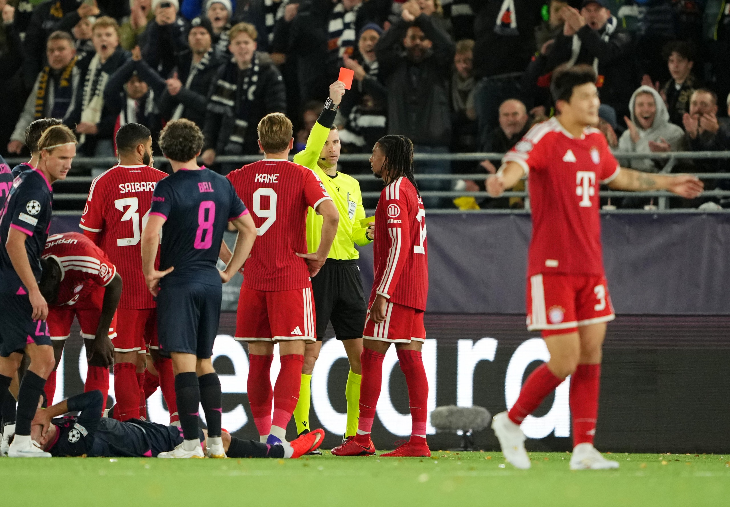 Michael Olise of Bayern Munich receives a red card against Viking
