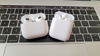 The AirPods Pro and AirPods 2 placed atop of a MacBook Pro (2019)