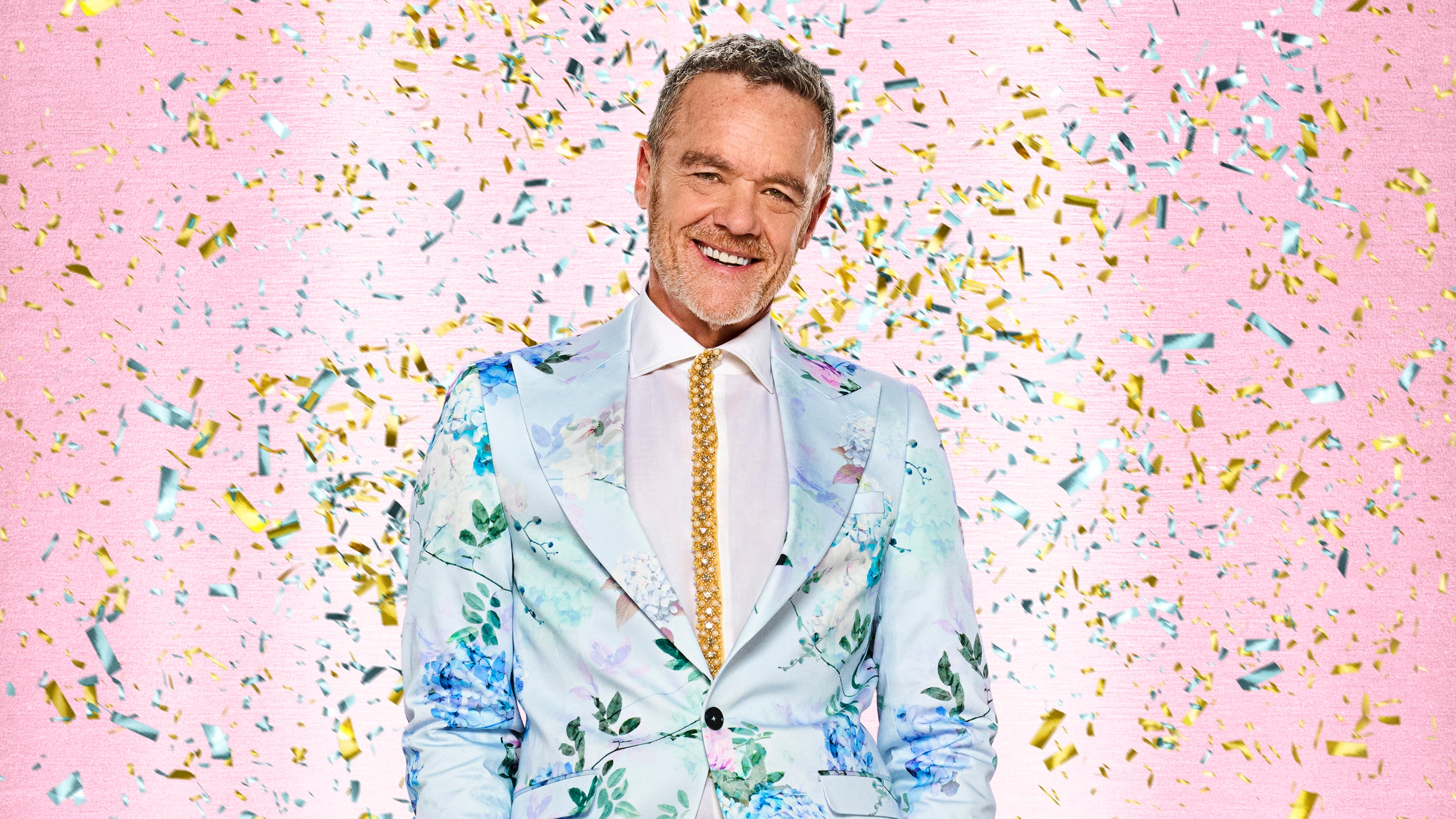 Strictly Come Dancing 2025 - Stefan Dennis in a blue sequinned suit with confetti falling around him.
