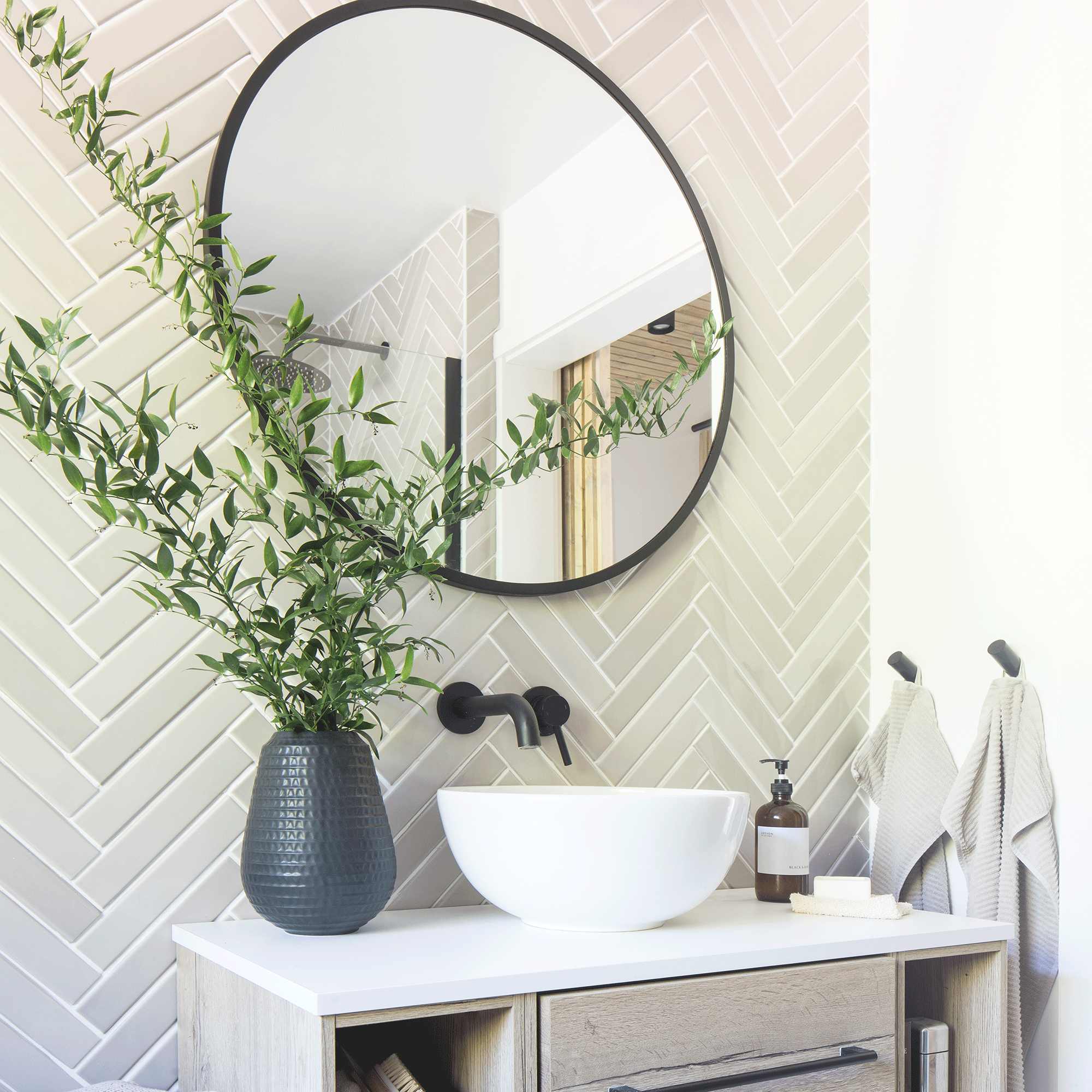 White bathroom with large mirror over basin