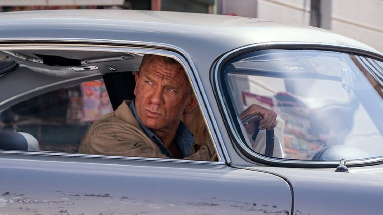 Daniel Craig as James Bond in Aston Martin DB5 in No Time to Die