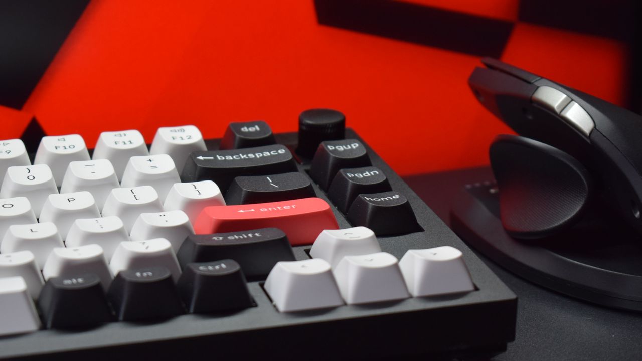 Photograph of the Keychron Q1 HE wireless keyboard next to a wireless mouse