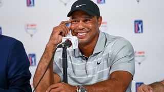 Tiger Woods talks to the media before the Hero World Challenge