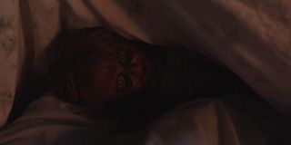 Annabelle under the sheets in Annabelle Comes Home