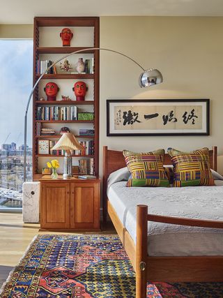 bedroom ideas with a bookcase and arc lamp