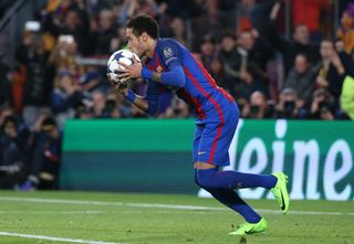 Neymar kisses the ball after scoring Barcelona's fifth goal against Paris Saint-Germain in the Champions League at Camp Nou in March 2017.