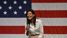Nikki Haley speaking in front of an American flag