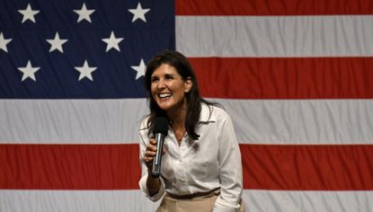 Nikki Haley speaking in front of an American flag