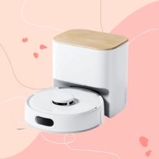 SwitchBot K11+ Robot Vacuum Cleaner with Mop on a pink background