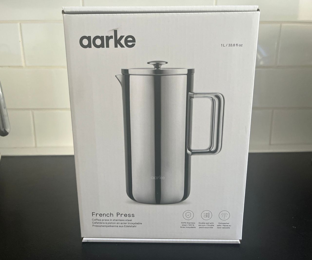 The white box for the aarke coffee press, with a picture of the stainless steel press on the front.