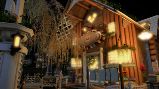 A small house lit up at night in Final Fantasy 14.