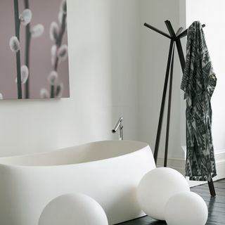 bathroom with bathtub and angular clothing stand