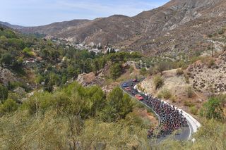The Vuelta a España peloton climbs into the Sierra Nevada