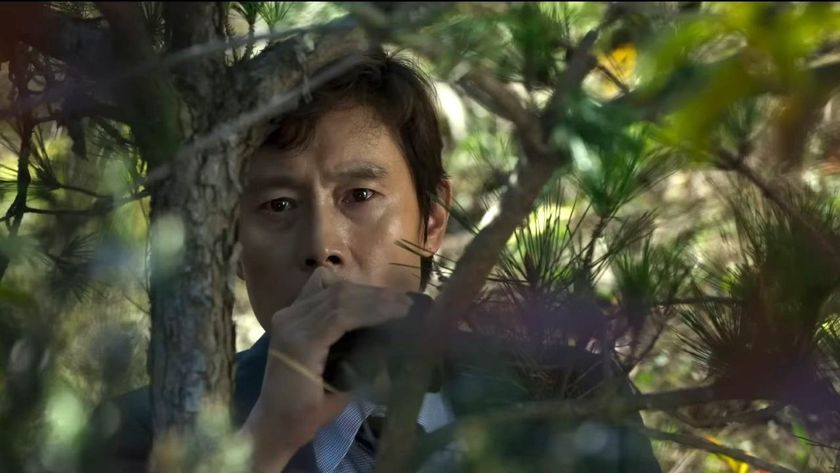 Lee Byung-hun in a tree in No Other Choice.