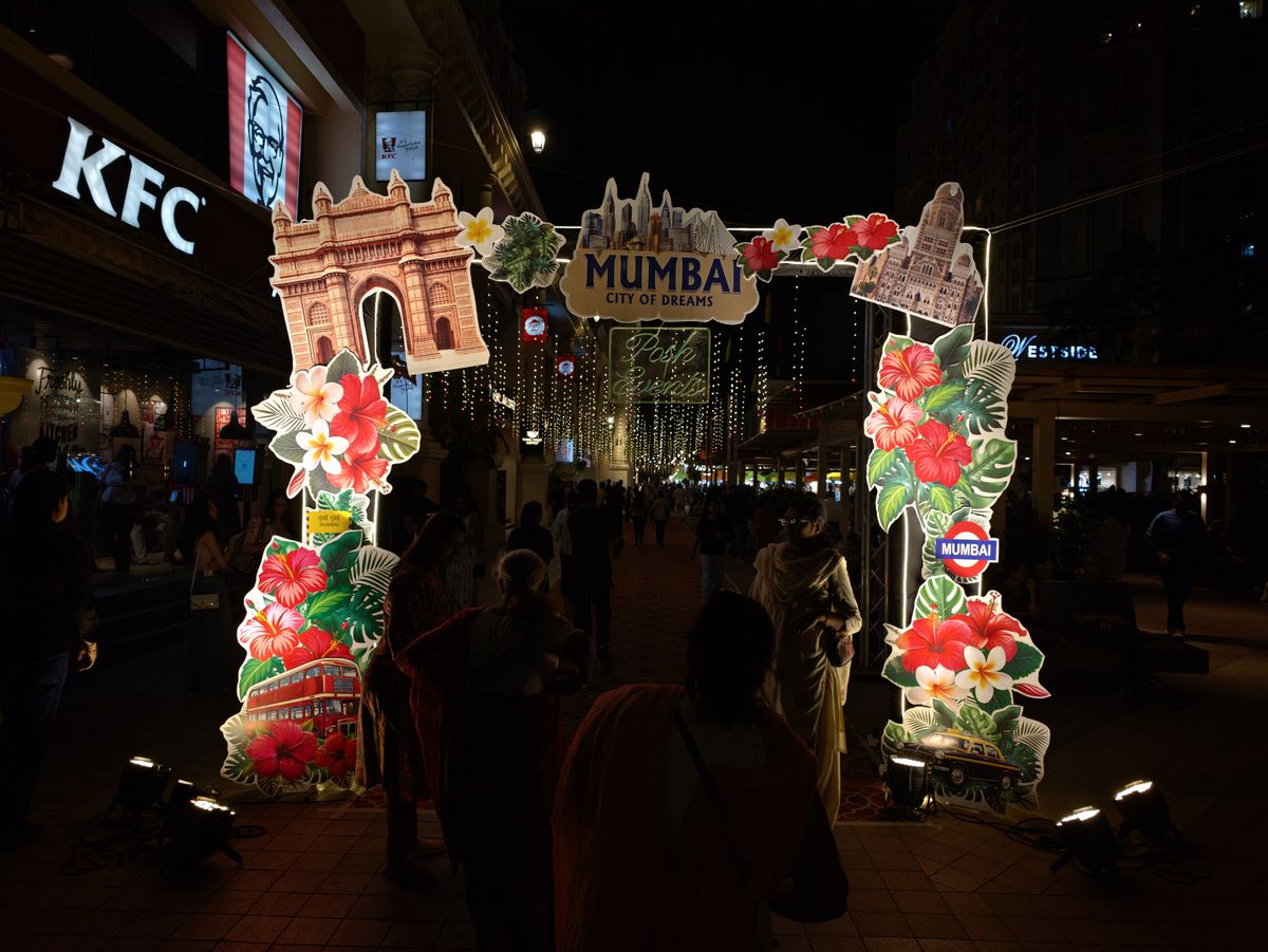 A Mumbai festival entrance at night.