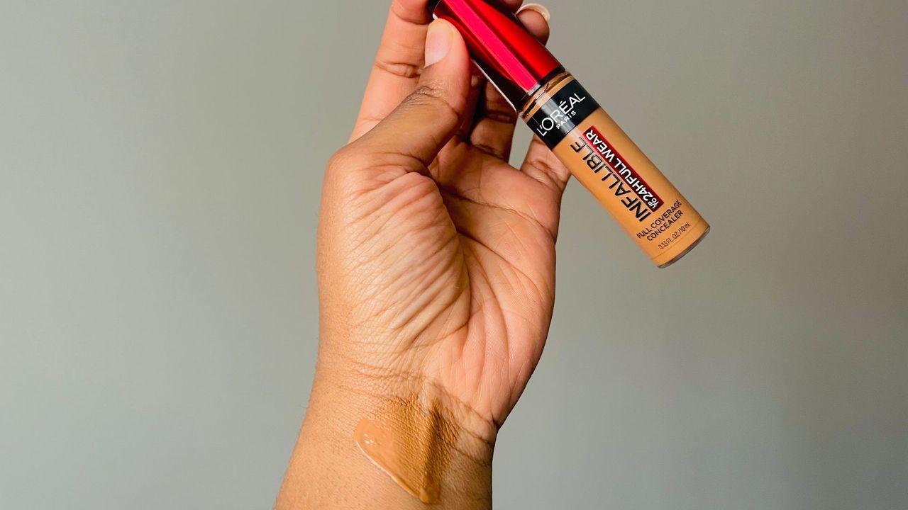 L'Oreal Infallible Full Wear Concealer color swatch on a person's wrist for the best drugstore concealers.