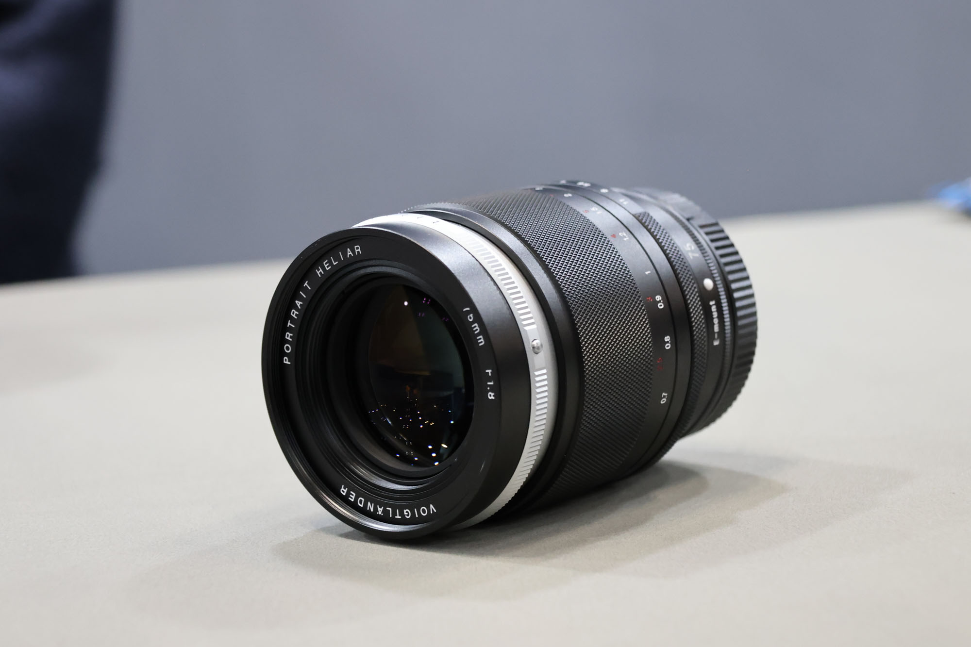 Voigtlander Heliar 75mm f/1.8 lens on a table at the CP+ show