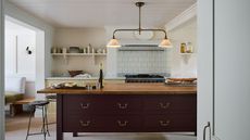 Bright kitchen with wooden island and open shelving