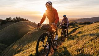 Enve MOG gravel bike being ridden in hills at sunset