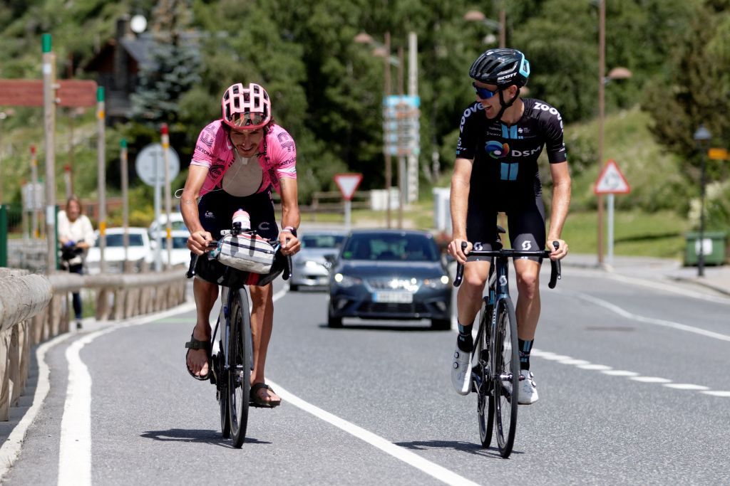 Australian cyclist Lachlan Morton L rides for a short moment with fellow Australian cyclist Chris Hamilton R on the 13th day of his solo alternative Tour de France cycling race near Soldeu in the principality of Andorra on July 8 2021 Lachlan Morton is riding every kilometer of the Tour de France plus the distances between race starts and finishes solo He stops at cafes for his food and sleep under the stars at night Morton is racing to raise money for World Bicycle Relief Photo by VALENTINE CHAPUIS AFP Photo by VALENTINE CHAPUISAFP via Getty Images