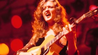 Bonnie Raitt performs on stage, New York, 1977. 