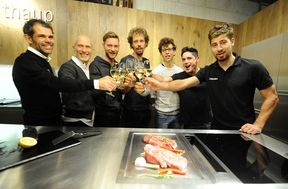 New signings Daniel Oss, Davide Formolo and Pete Kennaugh raise a glass with Peter Sagan and team sponsors