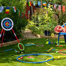 garden with coloured plastic toys for garden games