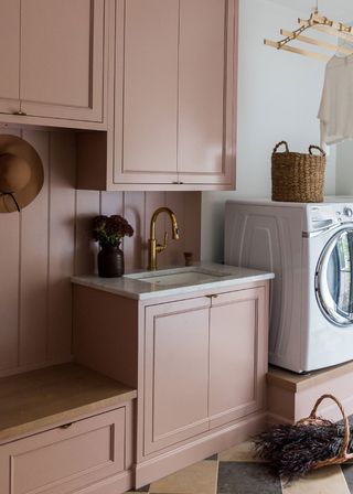 Farmhouse decor ideas, pink pantry with sink and washing machine, tiled flooring