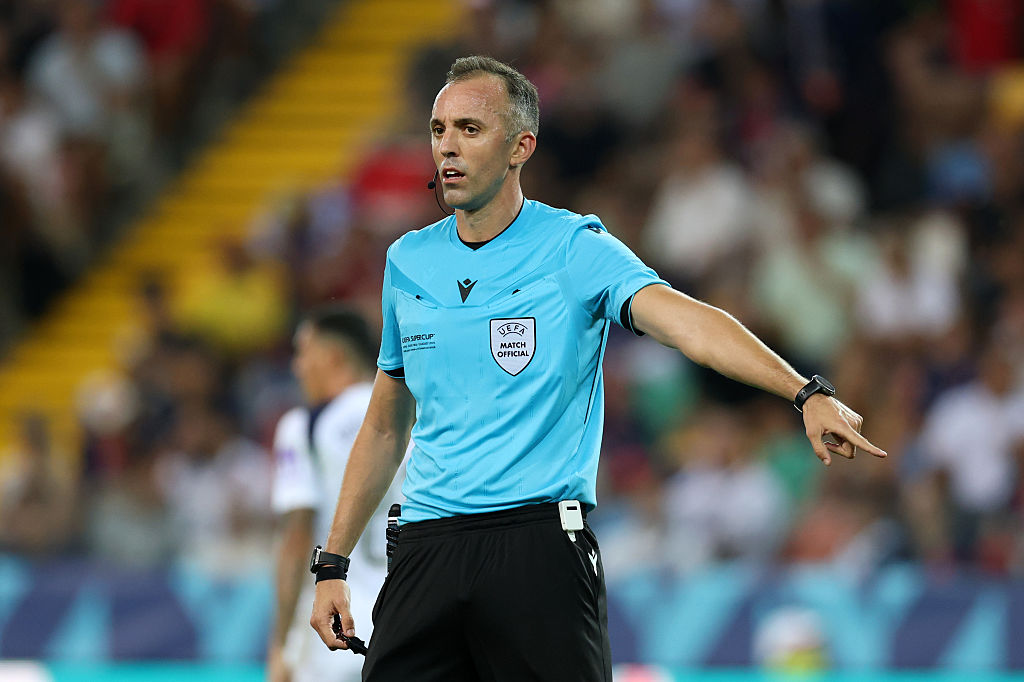 Referee Joao Pinheiro gestures during the UEFA Super Cup 2025 match between Paris Saint-Germain and Tottenham Hotspur at Stadio Friuli 