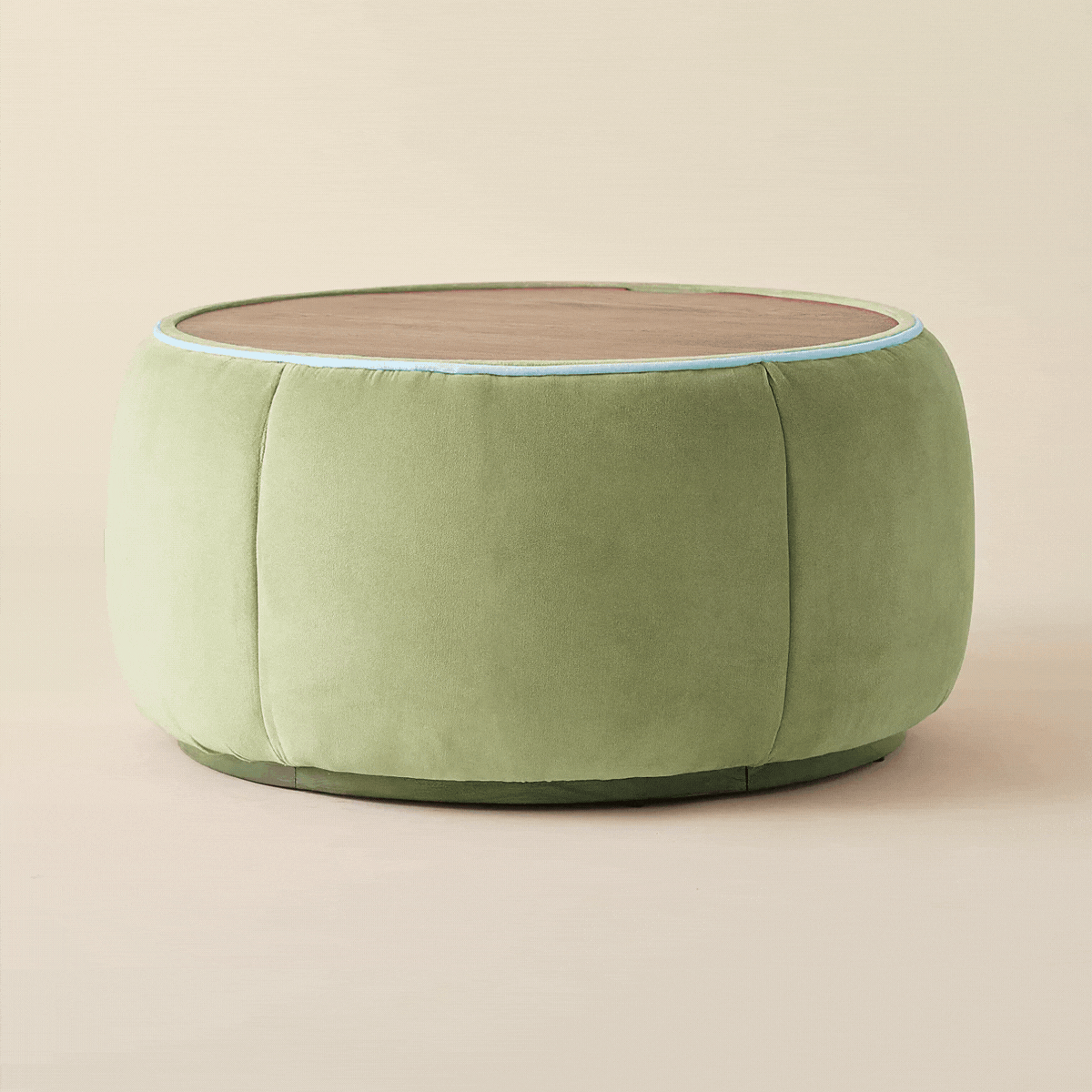 A wood coffee table with hidden storage and a green body