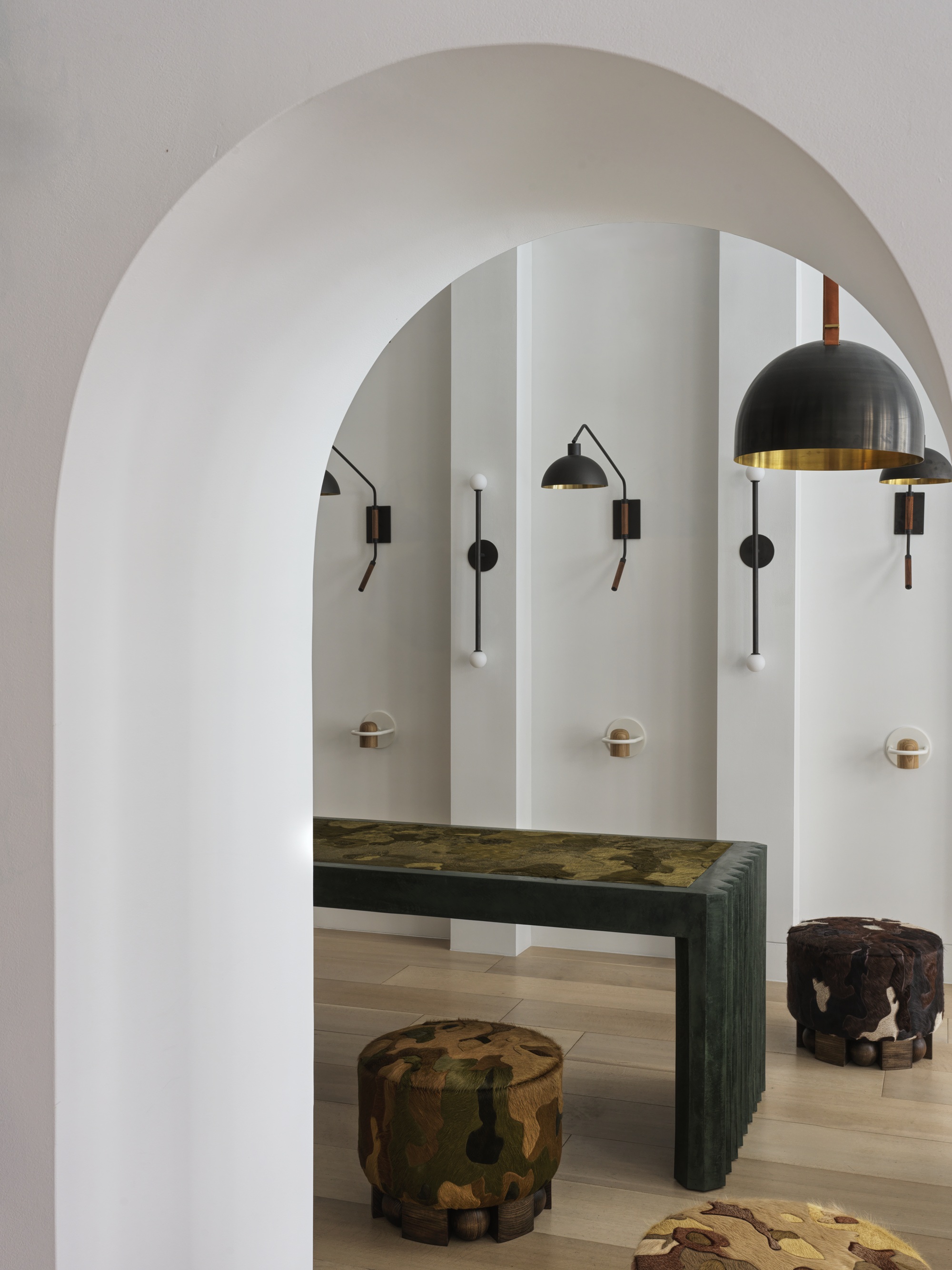 poufs with organic shapes made from animal hair on hide