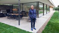 Kevin Mccloud stood in front of a newly built house