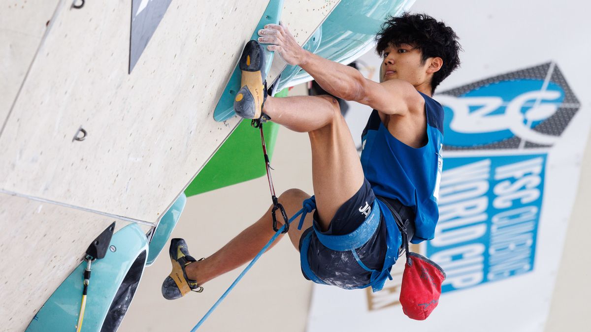 Sorato Anraku of Japan, in a blue vest and shorts, competes during the men&#039;s lead competition in the sports climbing at the 2024 Paris Olympic Games.