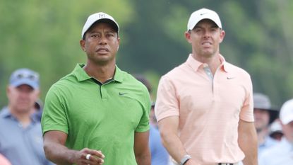 Tiger Woods and Rory McIlroy walk the fairways 