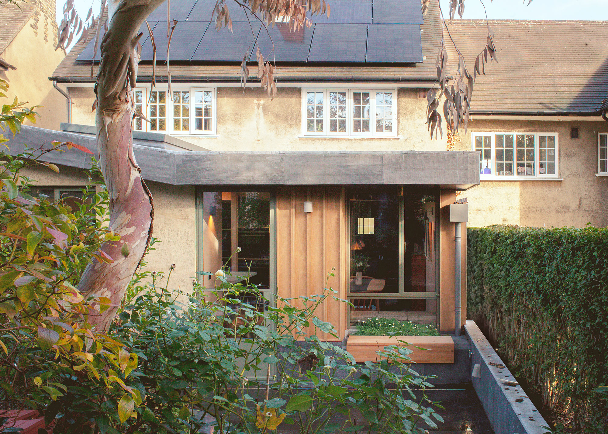 extension to cottage with small garden and rainwater harvesting