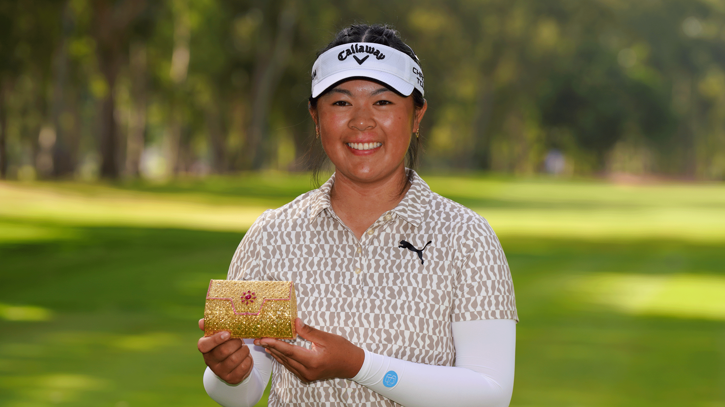 Canada's Anna Huang poses with the Lalla Meryem Cup trophy following her win in 2026