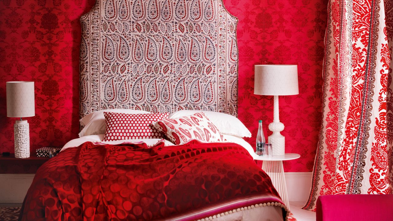 Red painted bedroom with scarlet accessories