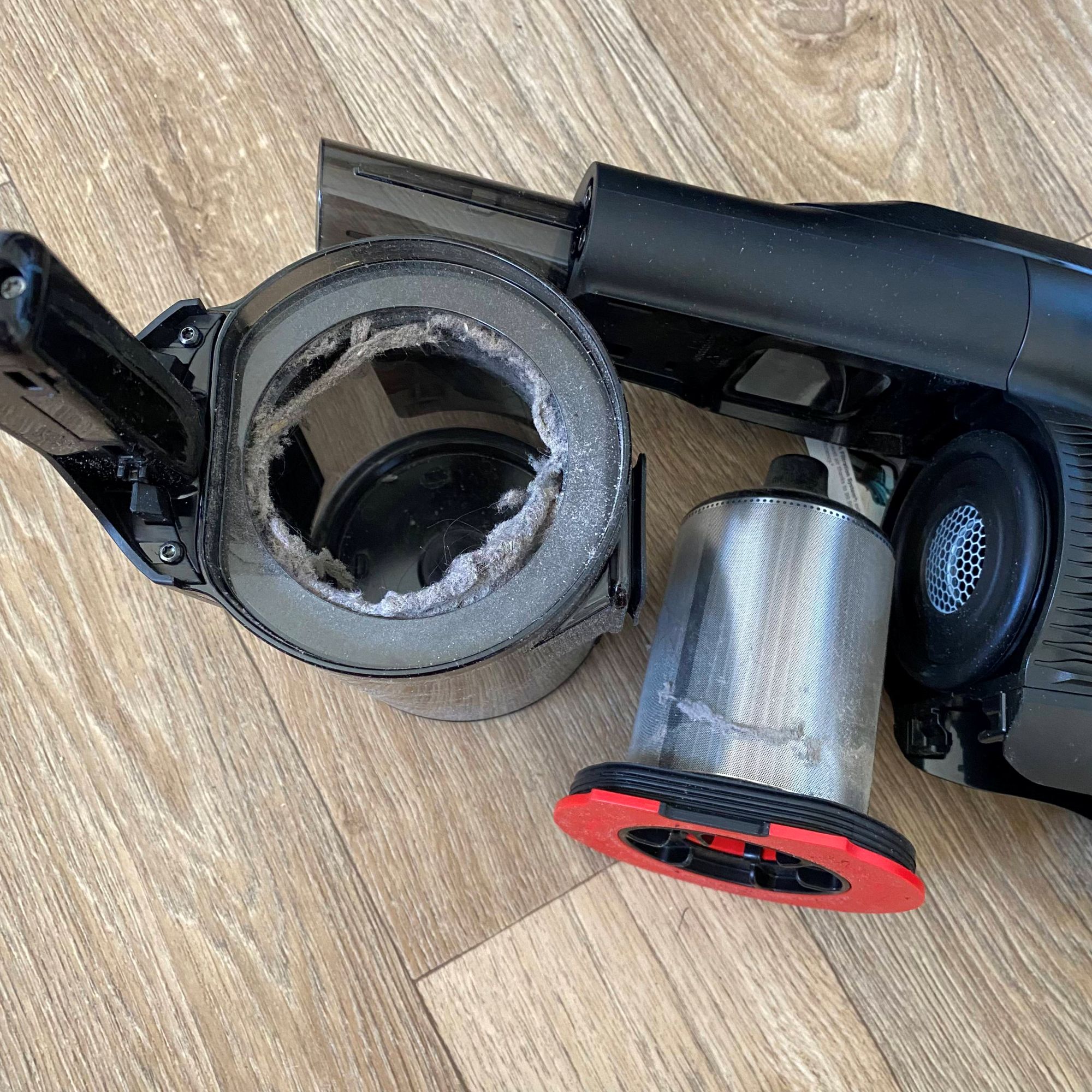 Bosch Unlimited 10 ProPower cordless vacuum being emptied and cleaned