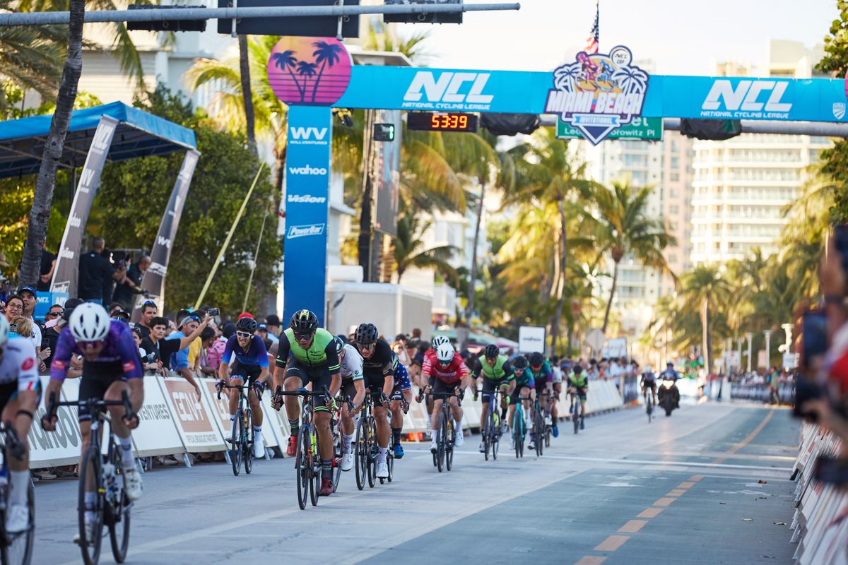 Riders cross the finish line after 25 laps of men's race at Miami Beach