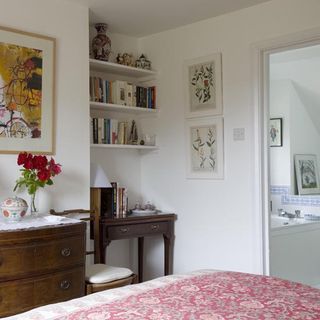 guest room with reading desk and bed