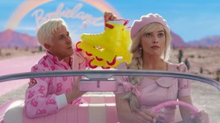 A scene from the Barbie movie showing Ryan Gosling and Margot Robbie driving out of Barbie Land