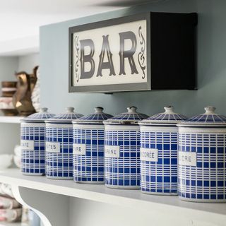 open shelf with blue jars
