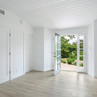 room with white wall and door