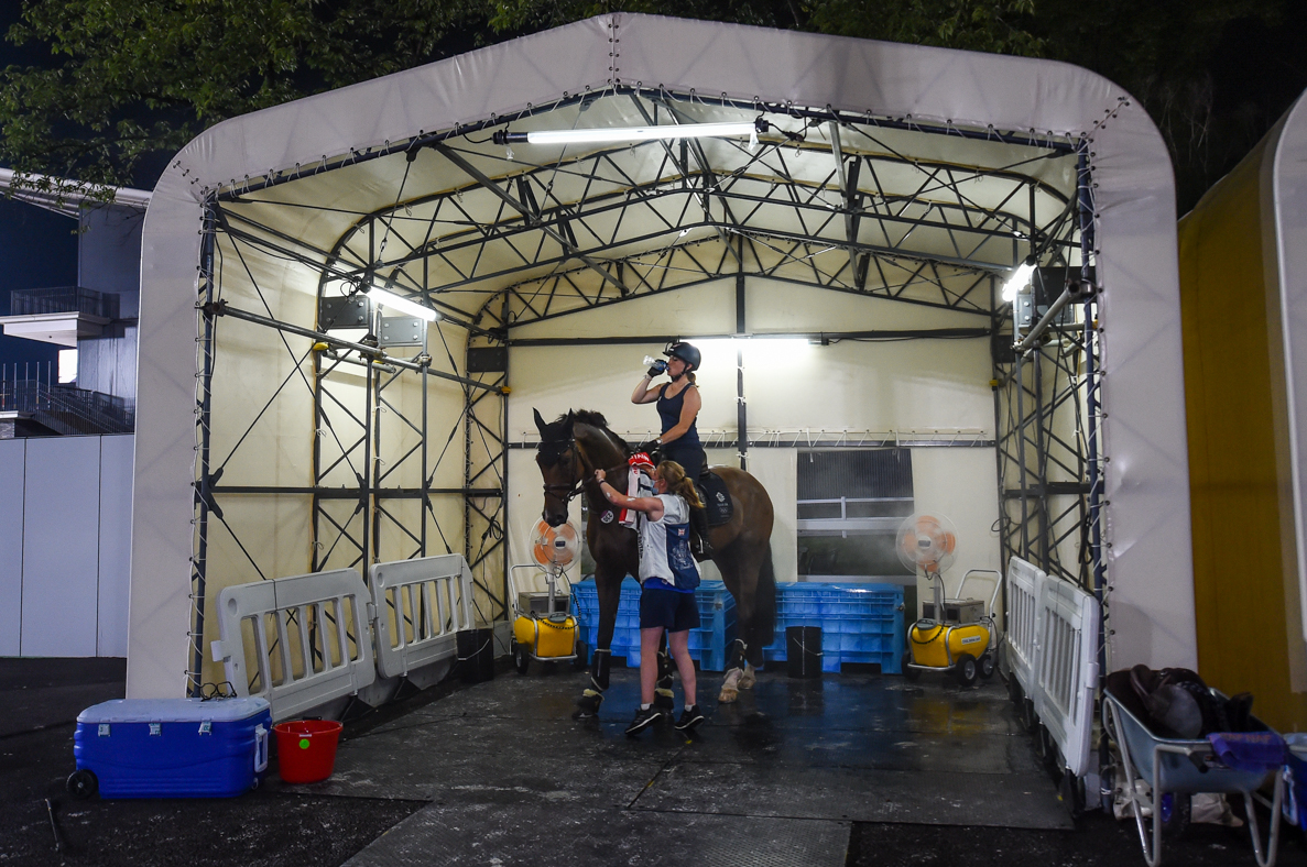 Olympic event horses in Tokyo: Laura Collett and London 52 in the cooling tent after arena familiarisation
