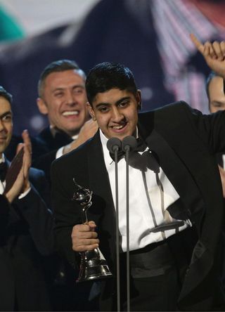 Musharaf Asghar accepts the award for Best Documentary for Educating Yorkshire during the 2014 National Television Awards.