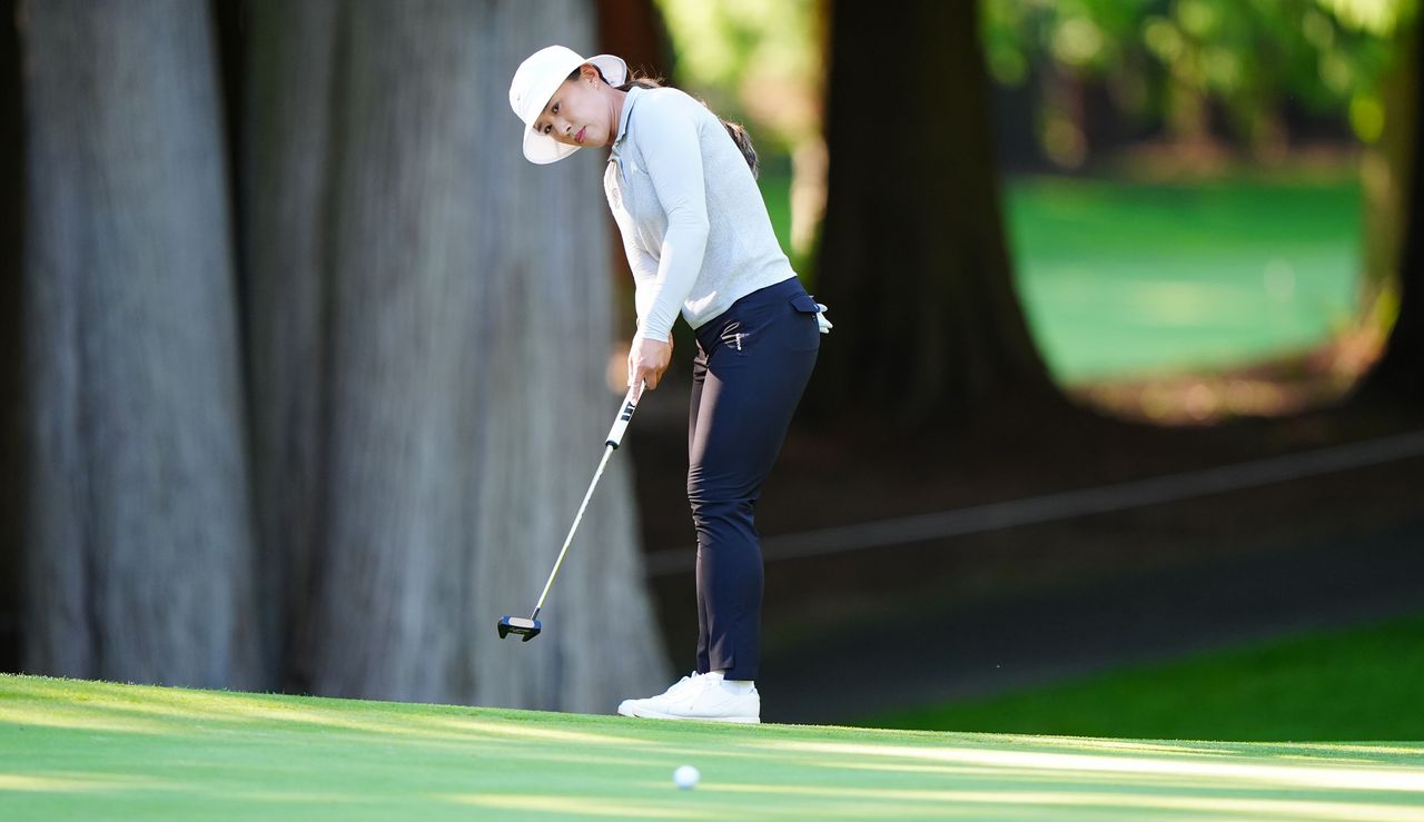 Amy Yang hits a putt on the 12th hole